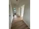 Hallway featuring hardwood floors, neutral walls, and white trim leading to bedrooms at 804 3Rd Street Sw Pl, Hickory, NC 28602