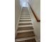 Interior staircase featuring wood treads and a classic railing design at 804 3Rd Street Sw Pl, Hickory, NC 28602
