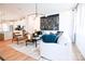 Open-concept living room with modern furniture, hardwood floors, and lots of natural light at 8044 Cedarsmith Ct, Charlotte, NC 28217