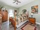 Bedroom with wood furniture, calm walls, ceiling fan, and natural light at 805 Brookmont Ave, Salisbury, NC 28146