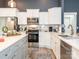 Modern kitchen features white cabinets, stainless steel appliances, and light countertops at 805 Brookmont Ave, Salisbury, NC 28146
