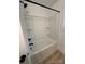 Clean, white bathtub and shower combination with black fixtures at 807 S Bostian St, China Grove, NC 28023