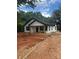 Charming new construction with white siding, black roof, and inviting front porch at 807 S Bostian St, China Grove, NC 28023