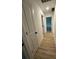 Hallway featuring modern vinyl flooring, leading to different areas of the home at 807 S Bostian St, China Grove, NC 28023