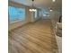 Open-concept living and dining area featuring wood floors and large windows at 807 S Bostian St, China Grove, NC 28023