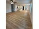 Bright, open-concept space with eat-in kitchen, ceiling fan, and modern flooring at 807 S Bostian St, China Grove, NC 28023