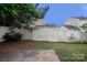 Fenced backyard offering privacy, greenery, and a patio area at 8432 Spirea Ct, Charlotte, NC 28215