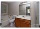 This bathroom is fully equipped with a shower and bath tub with great natural lighting at 8432 Spirea Ct, Charlotte, NC 28215