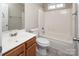 The bathroom includes a vanity, toilet, and tub/shower combo for functionality and style at 8432 Spirea Ct, Charlotte, NC 28215