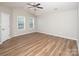The bedroom boasts a ceiling fan and natural light for a cozy and inviting atmosphere at 8432 Spirea Ct, Charlotte, NC 28215