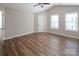 This airy bedroom has hardwood floors and is ready to be personalized and enjoyed at 8432 Spirea Ct, Charlotte, NC 28215