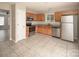 Cozy kitchen featuring oak cabinets, stainless steel appliances, and a granite countertop at 8432 Spirea Ct, Charlotte, NC 28215