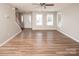 Bright living room featuring hardwood floors and stairs at 8432 Spirea Ct, Charlotte, NC 28215