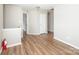 Upstairs bonus room featuring wood floors and a neutral paint scheme at 8432 Spirea Ct, Charlotte, NC 28215