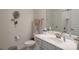 Cozy bathroom featuring a vanity, toilet, and a shower with white tile at 9062 Treetop Nw Way, Concord, NC 28027