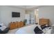 Spacious bedroom with a king-sized bed, wooden dresser, and ample closet space at 9062 Treetop Nw Way, Concord, NC 28027