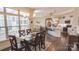Dining room showcases a view into kitchen and living room, with abundant natural light at 9062 Treetop Nw Way, Concord, NC 28027