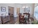 Inviting dining room with modern decor and hardwood floors, ideal for gatherings at 9062 Treetop Nw Way, Concord, NC 28027