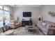Comfortable living room with stylish furniture, modern TV, and natural light from a large window at 9062 Treetop Nw Way, Concord, NC 28027