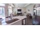 Open-concept layout, with kitchen island, seamlessly connecting to the living room, perfect for entertaining at 9062 Treetop Nw Way, Concord, NC 28027