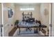 Inviting home office setup, complete with desk, shelving and comfortable workspace at 9062 Treetop Nw Way, Concord, NC 28027