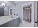 A neutral bathroom with double sinks, a large mirror, and a separate shower area at 9807 Aristides Dr, Waxhaw, NC 28173