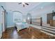 Light-filled bedroom featuring hardwood floors, a vaulted ceiling, and a unique design at 9807 Aristides Dr, Waxhaw, NC 28173