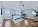 Spacious main bedroom features hardwood floors, a ceiling fan, and a dedicated office space at 9807 Aristides Dr, Waxhaw, NC 28173