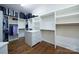 Spacious walk-in closet with custom shelving, an island, and ample storage at 9807 Aristides Dr, Waxhaw, NC 28173