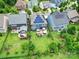 Aerial view showcasing a well-maintained backyard with a patio, hot tub, and lush lawn at 998 Emory Ln, Fort Mill, SC 29708