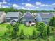 Aerial view of a spacious backyard with patio, hot tub, and mature landscaping at 998 Emory Ln, Fort Mill, SC 29708