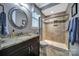 Bathroom with granite countertop vanity and enclosed shower with tile accent wall at 998 Emory Ln, Fort Mill, SC 29708