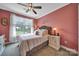 Bedroom with an upholstered headboard, a ceiling fan, and a view of the yard at 998 Emory Ln, Fort Mill, SC 29708