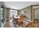 Bright dining room featuring a wooden table, decorative rug, and large windows letting in natural light at 998 Emory Ln, Fort Mill, SC 29708
