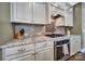Modern kitchen featuring granite countertops, stainless steel appliances, a tile backsplash, and ample cabinet space at 998 Emory Ln, Fort Mill, SC 29708