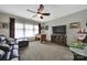 Relaxing living room features a brown leather sofa, foosball table, and large television for entertainment at 998 Emory Ln, Fort Mill, SC 29708