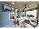 Comfortable outdoor seating area features a sectional sofa, side table, and ceiling fan at 998 Emory Ln, Fort Mill, SC 29708