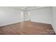 Minimalist bedroom with hardwood flooring, neutral colors, and ample space for customization at 1048 Waxhaw Crossing Dr # 261, Waxhaw, NC 28173