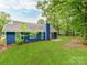 Well-maintained backyard with lush green grass, a patio, and mature trees for shade and privacy at 10736 Spruce Mountain Rd, Charlotte, NC 28214