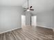A spacious bedroom showcases a vaulted ceiling, ceiling fan, and plank flooring at 10736 Spruce Mountain Rd, Charlotte, NC 28214