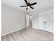 Bedroom with ceiling fan, plank flooring, and double door closet at 10736 Spruce Mountain Rd, Charlotte, NC 28214