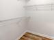 Walk-in closet with wire shelves and plank flooring at 10736 Spruce Mountain Rd, Charlotte, NC 28214