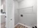 Convenient laundry room includes washer and dryer hookups with a wire shelf for storage at 10736 Spruce Mountain Rd, Charlotte, NC 28214