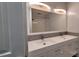 Bathroom featuring double sinks, a mosaic tile backsplash, and modern lighting at 109 Pepper Cir, Mooresville, NC 28117