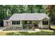 Charming single-story home with a welcoming porch and a well-manicured front yard at 109 Pepper Cir, Mooresville, NC 28117