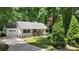 Inviting white home featuring front porch, attached garage, and a well-landscaped front yard at 109 Pepper Cir, Mooresville, NC 28117