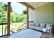 Back porch with swing, green scenery in the background, featuring an outdoor entertaining space at 114 Wingard Rd, Concord, NC 28025