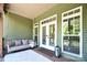 Back porch with swing and exterior of the home, featuring an outdoor entertaining space at 114 Wingard Rd, Concord, NC 28025