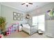 Lovely bedroom with a gray crib, decorations and plenty of storage, creating a welcoming space at 114 Wingard Rd, Concord, NC 28025