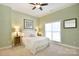 Green bedroom featuring a ceiling fan, carpet, and neutral walls, exuding a modern and cozy feel at 114 Wingard Rd, Concord, NC 28025